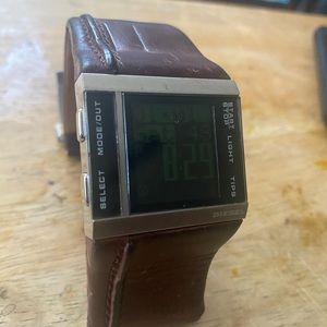 Digital diesel watch with brown leather band.